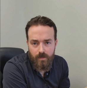 man sitting in chair in office